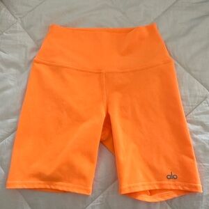 Like new neon orange ALO brand shorts in size XS.